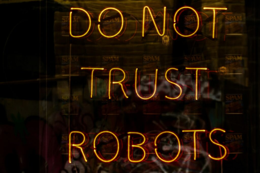 An illuminated sign reading Do Not Trust Robots